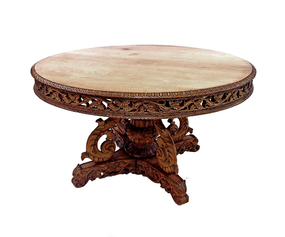 Good 19th century Goanese carved hardwood centre table, the circular top with darted boarders and