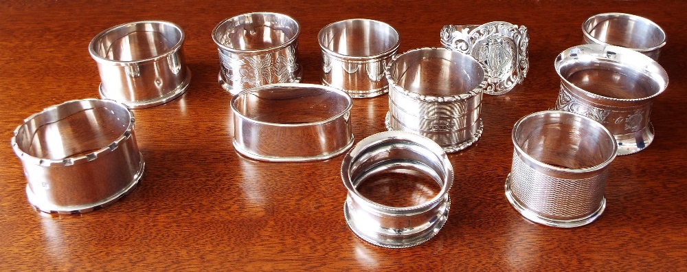 Eleven various antique and later silver napkin rings to include an ornate pierced example, maker