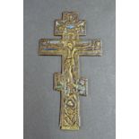 Antique bronze crucifix decorated with enamel highlights and engraved with scrolled foliage to the