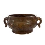 Large Chinese bronze twin handled censer decorated in relief with dragons, fish and birds, with