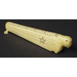 Antique scrimshaw cribbage board in the form of a walrus, 11" long