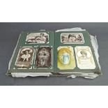 Vintage postcard album with various antique and later postcards