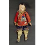 Interesting Chinese doll with painted wooden face and hands, wearing traditional clothing, 19" long