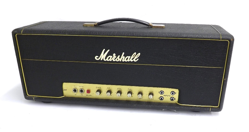 1976 Marshall JMP MK 2 guitar amplifier head, ser. no. S/A2186H, with a cream badged dust cover;