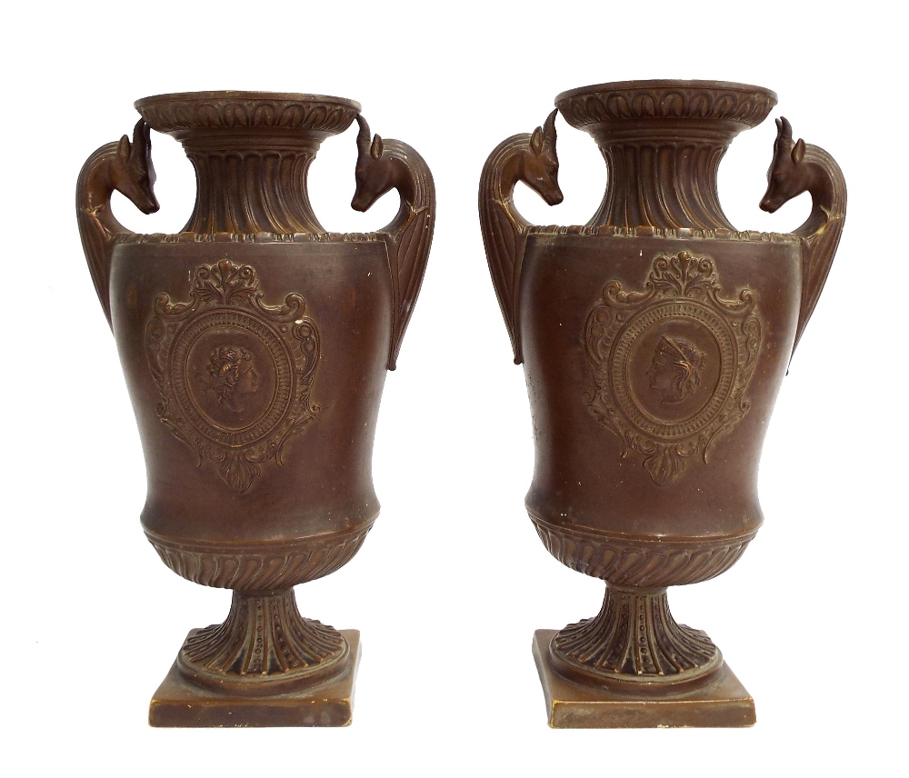 Pair of German ceramic twin handled vases, each centrally fitted with a cameo plaque and with