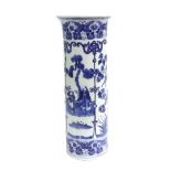 Chinese blue and white porcelain cylinder vase, decorated with figures and birds in trees,