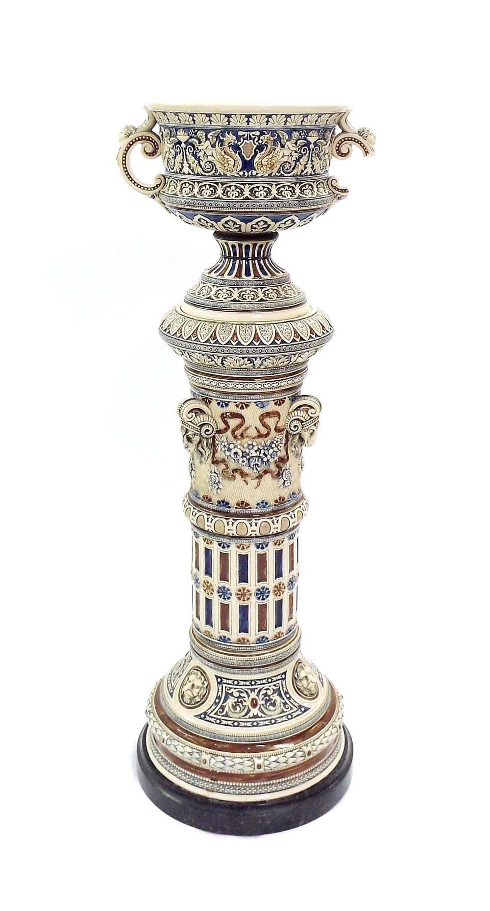 Impressive twin-handled jardiniere and stand in the manner of Doulton, fitted to a black marble