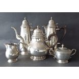 Five piece silver tea and coffee service in the Arts & Crafts manner, with Celtic type decoration,