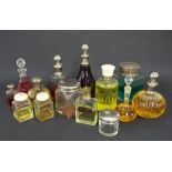 Collection of fourteen cut glass and other scent bottle, with etched decorations and silver lid (14)