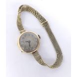 9ct lady's wristwatch on a mesh bracelet, silvered dial with Arabic numerals, Chester 1928, 20.