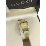 Gucci 18ct lady's quartz bracelet watch, ref. 715L, no. 0000951, plated bracelet, 21mm; with