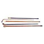 Five walking sticks, three with horn handles and two with yellow metal collars (5)