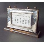 1930s silver framed perpetual calendar, on wooden plinth base, maker WJ Myatt & Co, Birmingham 1937,