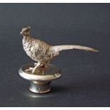 20th century silver cork mounted by a pheasant, maker John Pinches, London 1984, 3" high, 3.5" long