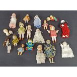 Collection of miniature dolls to include eleven porcelain dolls and eight others, many of the