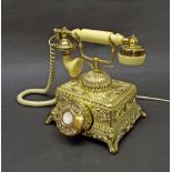 Flamboyant gilt vintage style telephone the base embossed with floral trails, 10" high