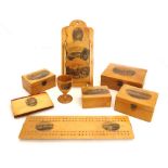 Mauchline ware - cribbage board, letter rack, egg cup and boxes decorated with transfers of the Isle