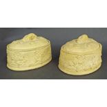 Pair of Wedgwood buff earthenware tureens, decorated in relief with various game and mounted by a