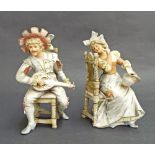 Pair of Continental seated bisque figures of a gentleman playing a mandolin serenading his lady, 10"