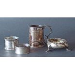 Victorian silver christening tankard, silver table salt and two napkin rings, 6oz approx (4)