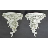 Pair of Meissen blanc de chine porcelain wall brackets in the form of cherubs amidst flowers and