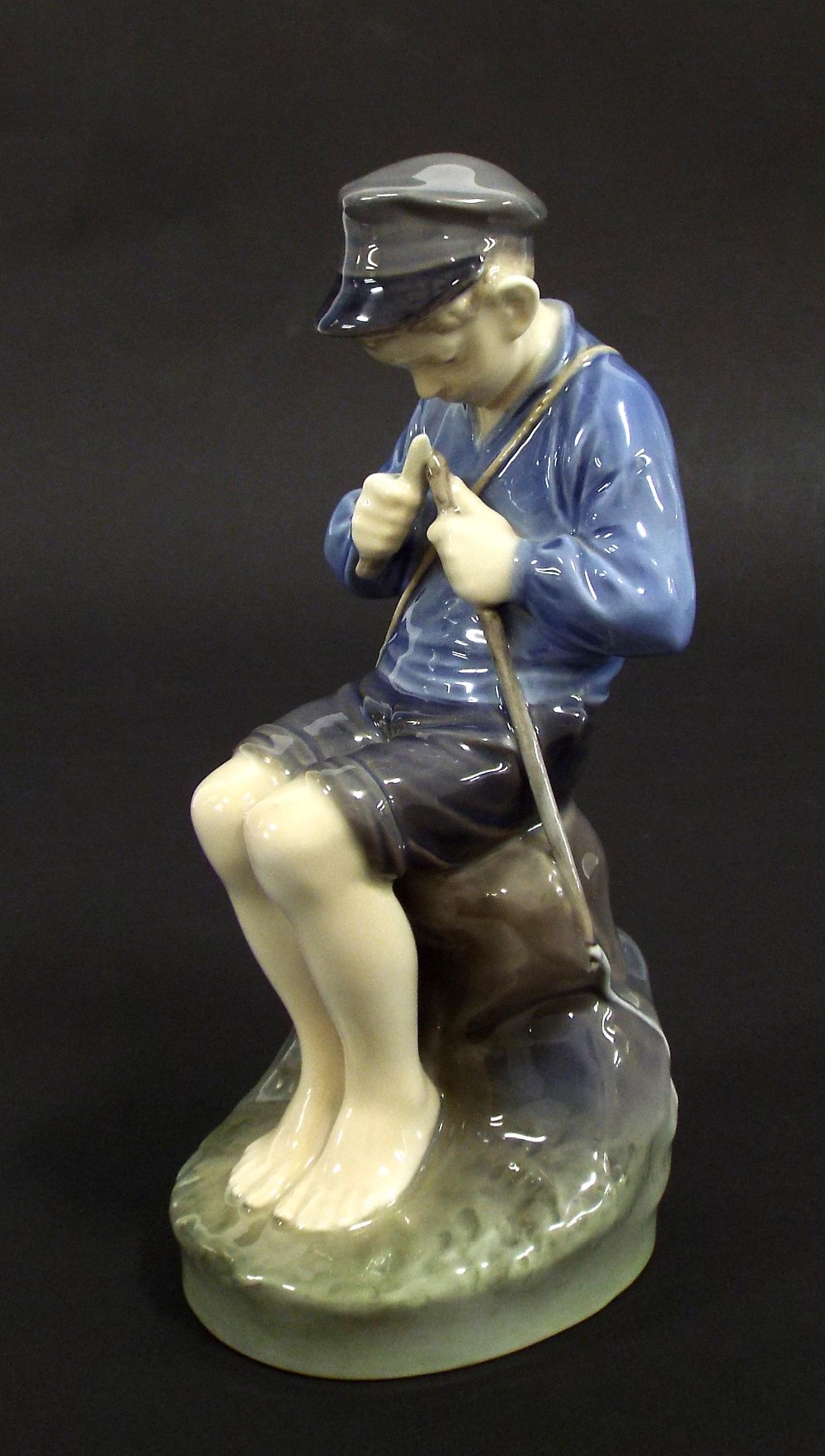 Royal Copenhagen porcelain figure of a fisher boy, no. 905, 7.5" high