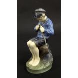 Royal Copenhagen porcelain figure of a fisher boy, no. 905, 7.5" high