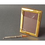 Samson Morden & Co silver pencil, 3" long; together with a modern silver-gilt easel picture frame,