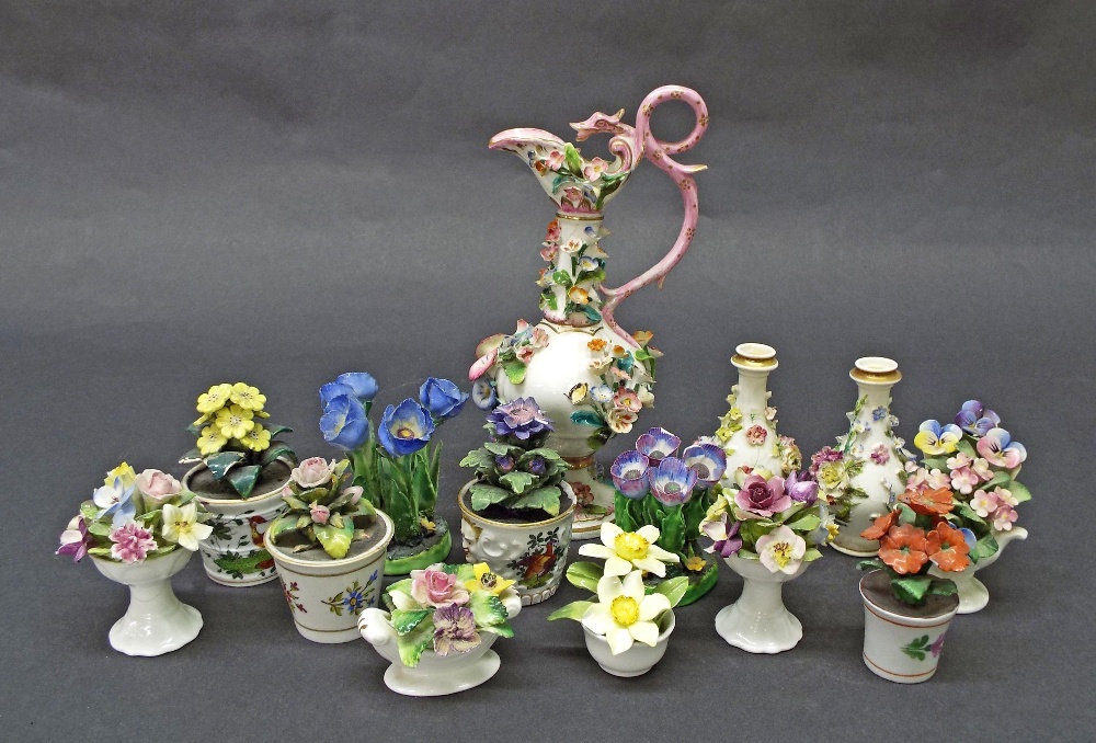 Collection of fourteen floral porcelain studies to include encrusted vases, bouquets etc