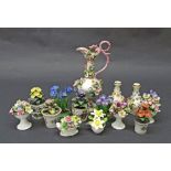Collection of fourteen floral porcelain studies to include encrusted vases, bouquets etc