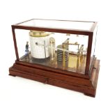 Mahogany barograph, within a hinged bevelled glazed case over a moulded base fitted with a chart