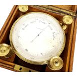 Oak cased ship's compensated barometer, the 4.5" silvered dial within a brass surround, within a