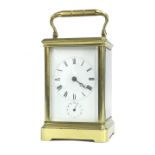 Good carriage clock timepiece with alarm and striking on a bell, within a corniche brass case, 7.