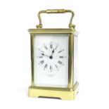 Large carriage clock timepiece inscribed Howell James & Co, To The Queen, London, within a