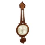 Walnut banjo barometer/thermometer, the 10" silvered scale within a shaped case applied with C-