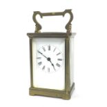 Carriage clock timepiece within a corniche brass case, 6" high (key)