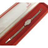 Tudor platinum and diamond lady's cocktail watch, rectangular silvered dial with Arabic numerals