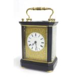 French ebonised and gilt metal carriage type clock striking on a small bell, the movement with