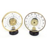 Two similar Jaeger mystery type barometers/thermometers, each with 6" Perspex circular dials above