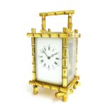 Good repeater carriage clock striking on a gong, within a gilded bamboo case, 8" high