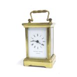 Miniature carriage clock timepiece signed Matthew Norman, London, within a corniche brass case, 4.