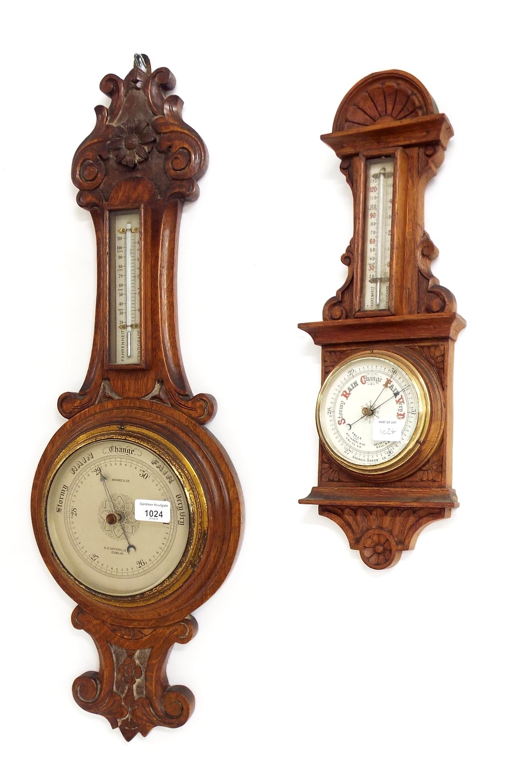 Two carved oak aneroid barometer/thermometers, the largest signed Moore & Co. to the silvered