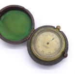 Brass cased aneroid pocket barometer, the dial signed J.W. Ray & Co., Liverpool, within a leather