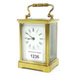 Carriage clock timepiece, within a corniche brass case, 5.5" high; within a Morocco leather