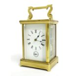 French carriage clock with alarm and striking on a gong, within a corniche brass case, 7.5" high