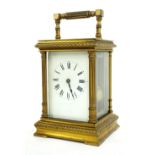 Large carriage clock timepiece striking on a gong, the indistinctly signed dial within a gilt