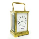 Henri Jacot carriage clock timepiece within a corniche brass case, 7" high