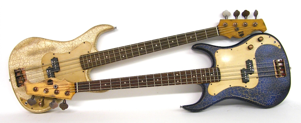 Two AXL bass guitars with distressed crackle finishes, one in blue, one in beige, both in working