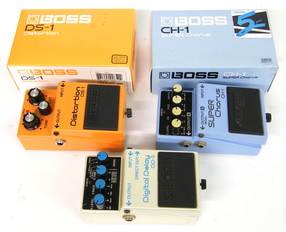 Boss BS-1 distortion pedal, boxed; together with a Boss DD-3 digital delay pedal, made in Japan, for