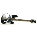 Squier by Fender skull design jazz bass guitar, the finish with various surface scratches, electrics